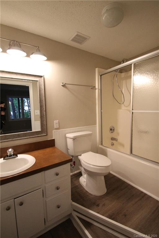 28006 Marina Drive, Unit 6 Tega Cay, SC 29708 - Photo 26 of 32 a bathroom with a sink a toilet and shower