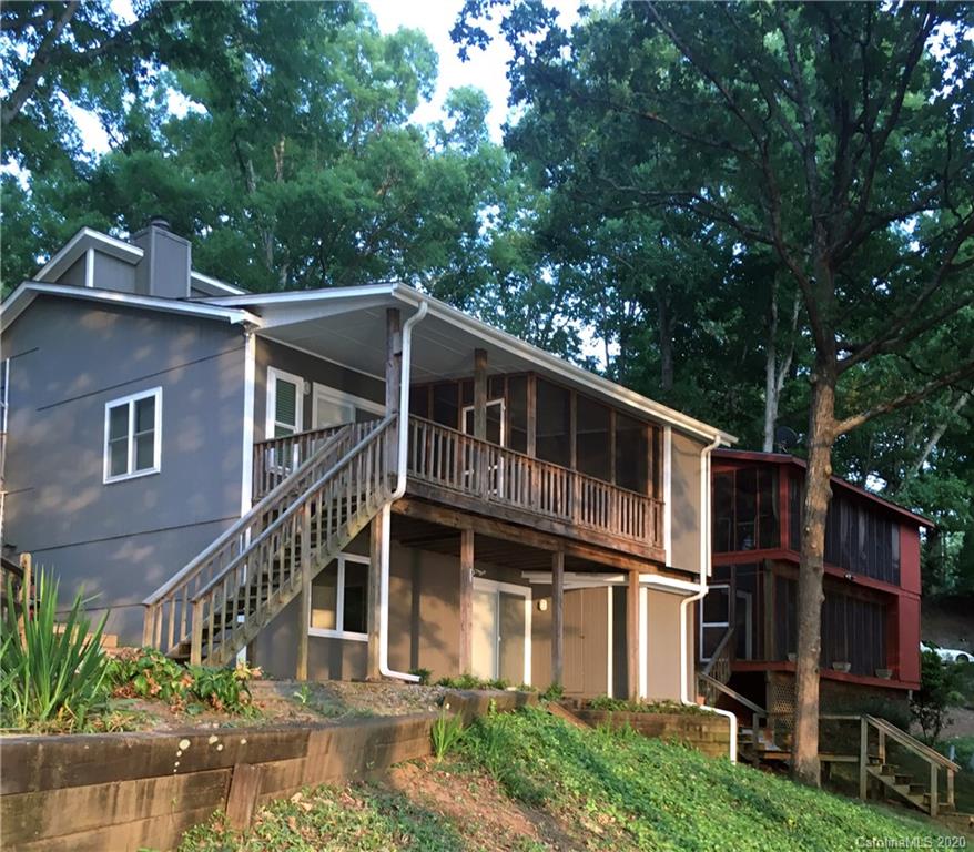 28006 Marina Drive, Unit 6 Tega Cay, SC 29708 - Photo 30 of 32 a front view of a house with yard porch and furniture