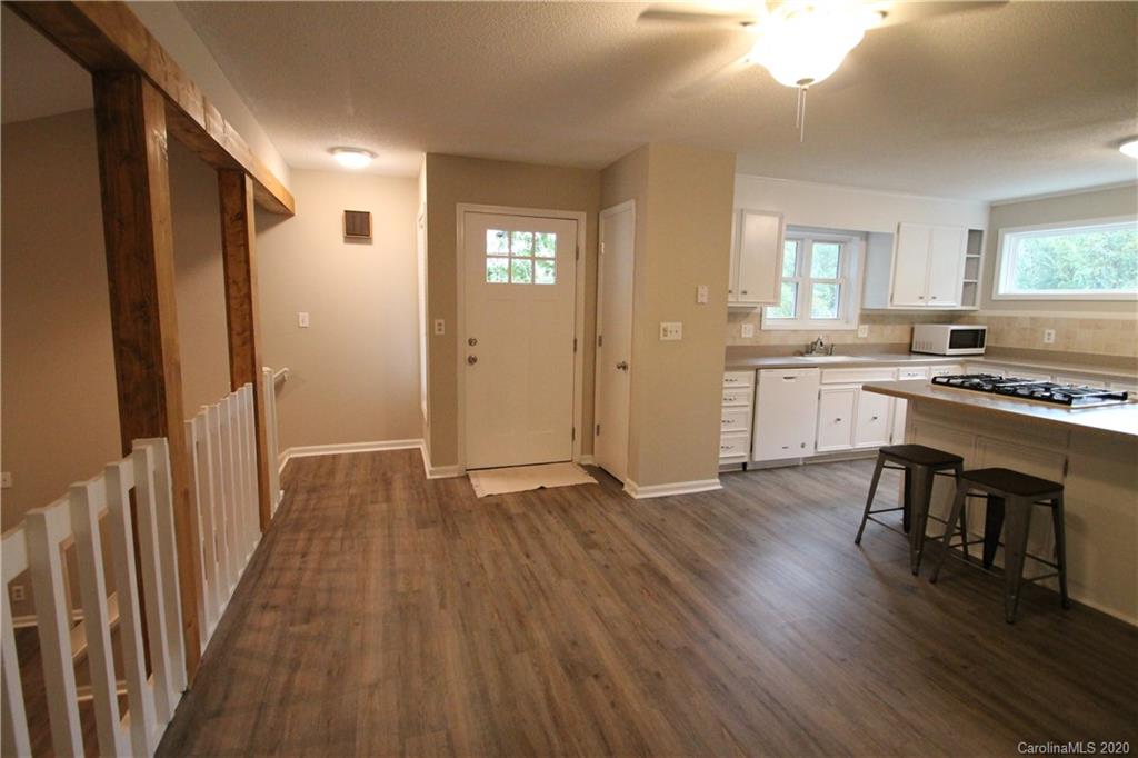 28006 Marina Drive, Unit 6 Tega Cay, SC 29708 - Photo 4 of 32 a view of kitchen with sink and wooden floor