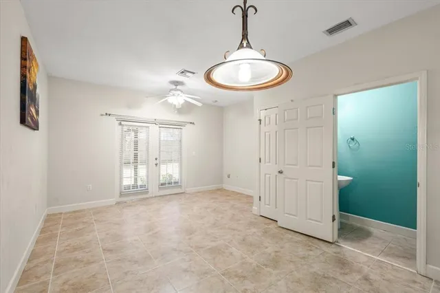 a view of a room with window and chandelier