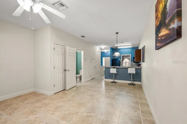 a view of a kitchen with a sink and cabinets