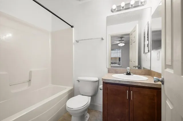 a bathroom with a toilet a sink and a bathtub