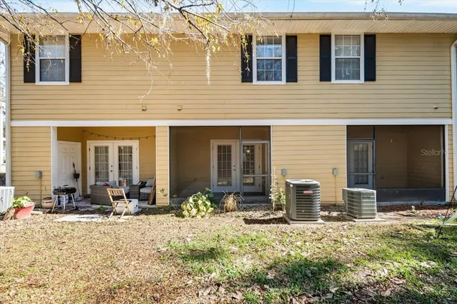 a front view of a house with many windows