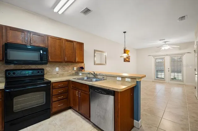a kitchen with a stove and a microwave