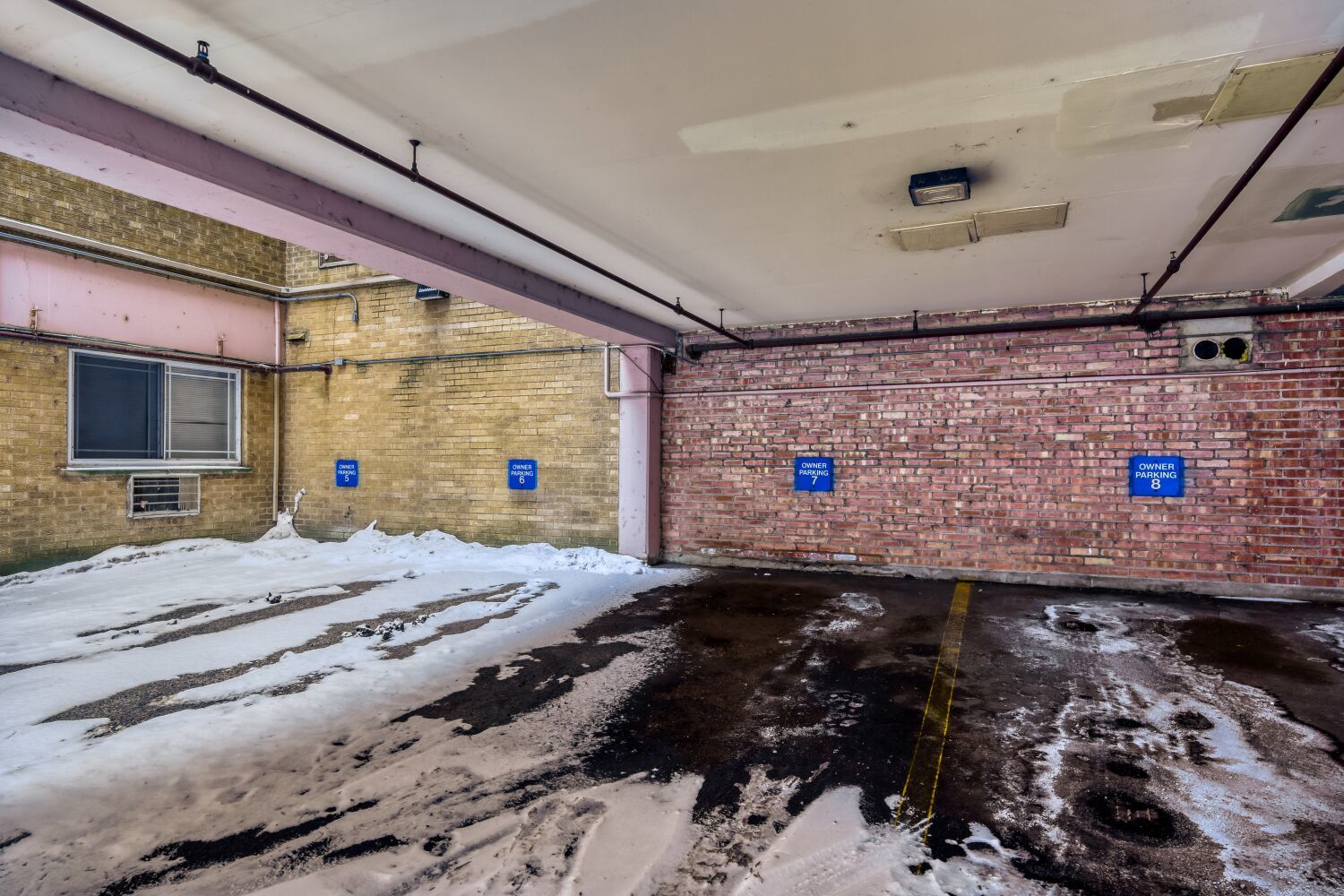 5400 North Sheridan Road, Unit 202 Chicago, IL 60640 - Photo 11 of 11 a bed room with a bed and a flat screen tv