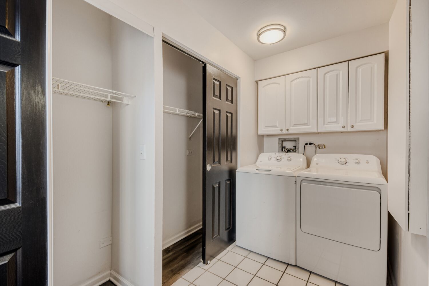 5400 North Sheridan Road, Unit 202 Chicago, IL 60640 - Photo 10 of 11 a utility room with cabinets washer and dryer