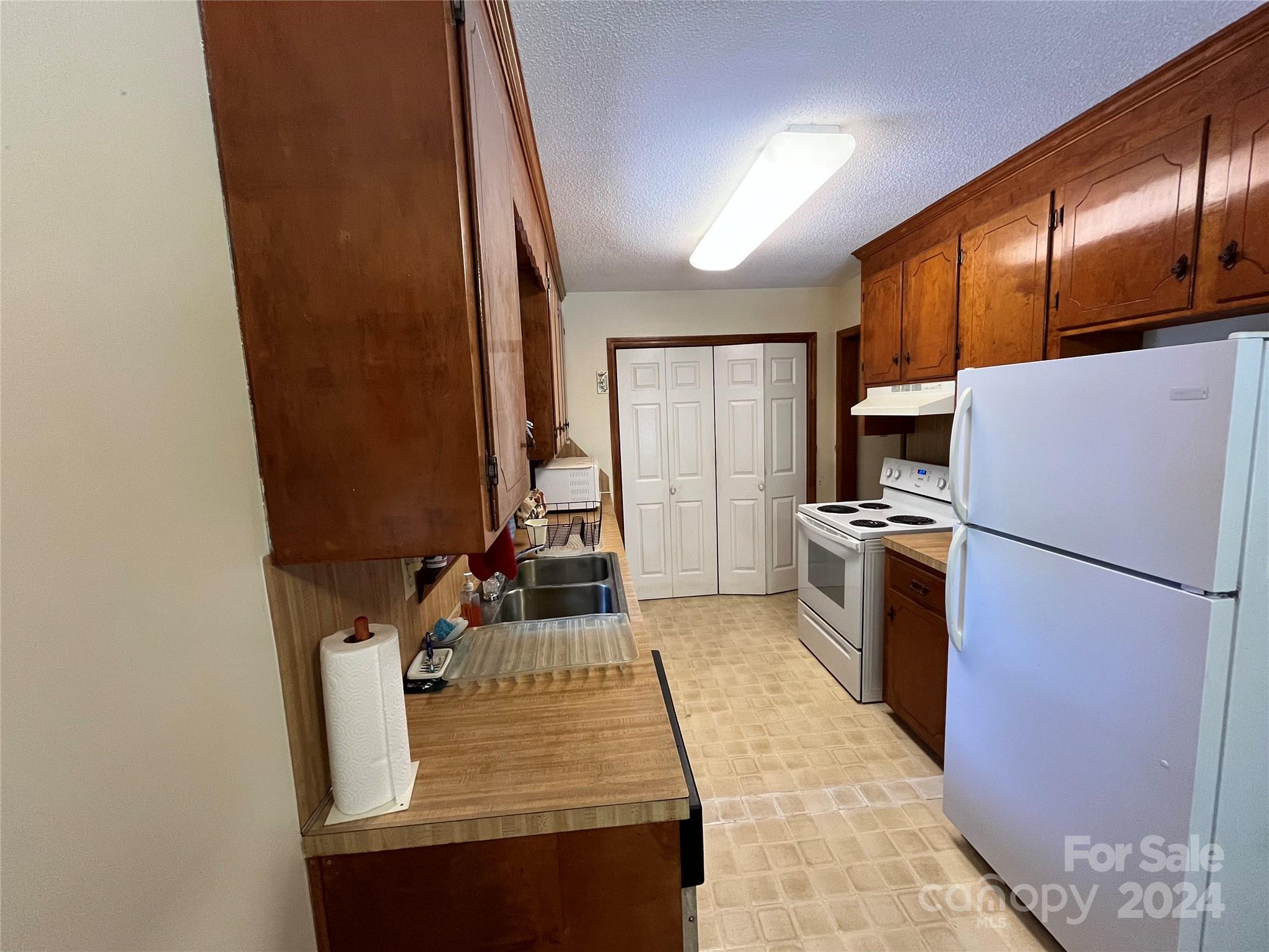 1821 Reservation Road Rock Hill, SC 29730 - Photo 10 of 22 a kitchen with refrigerator and window