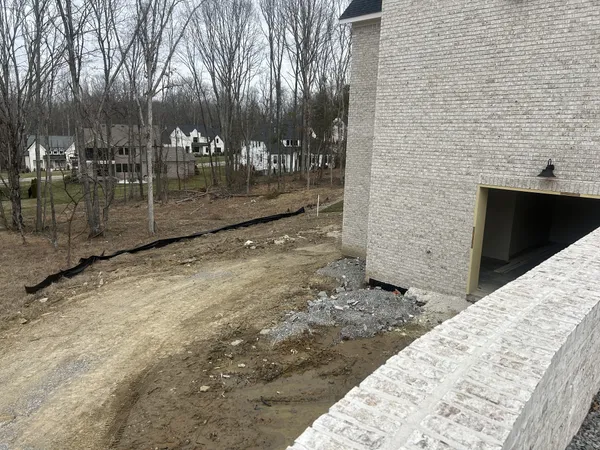 a view of a backyard of the house