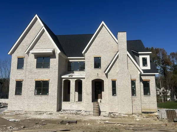 a view of a large house with a yard