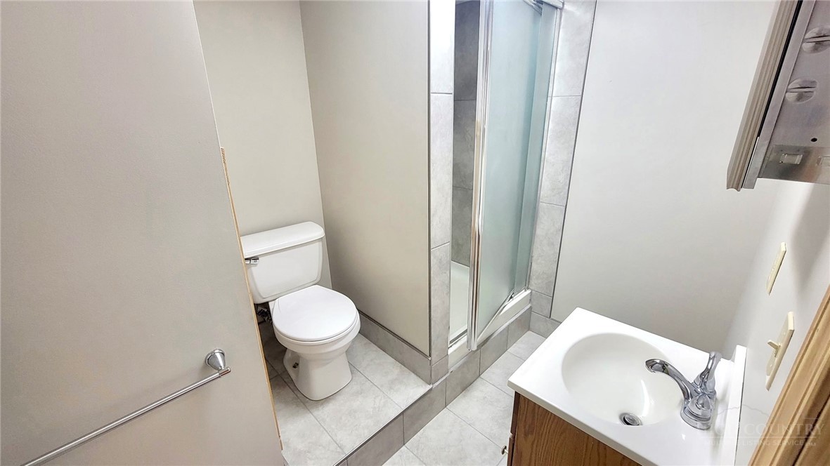 172 Yarrow Lane Boone, NC 28607 - Photo 23 of 30 a white toilet sitting next to a bathroom sink
