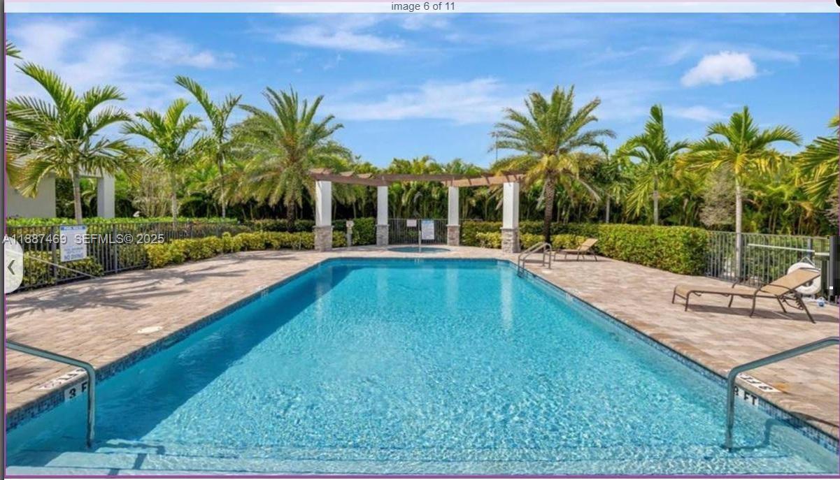 3575 Northwest 1st Street Pompano Beach, FL 33069 - Photo 14 of 18 a swimming pool with outdoor seating and yard