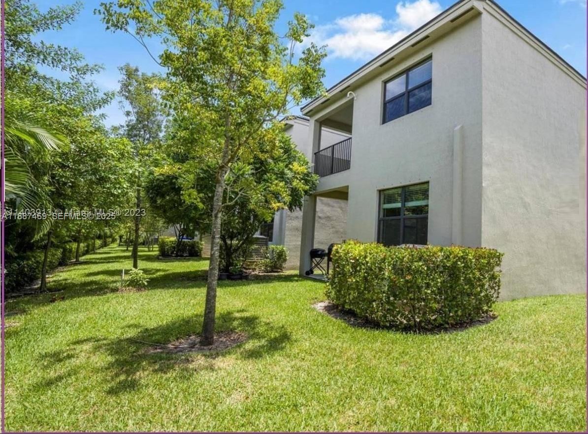 3575 Northwest 1st Street Pompano Beach, FL 33069 - Photo 18 of 18 a front view of a house with a yard