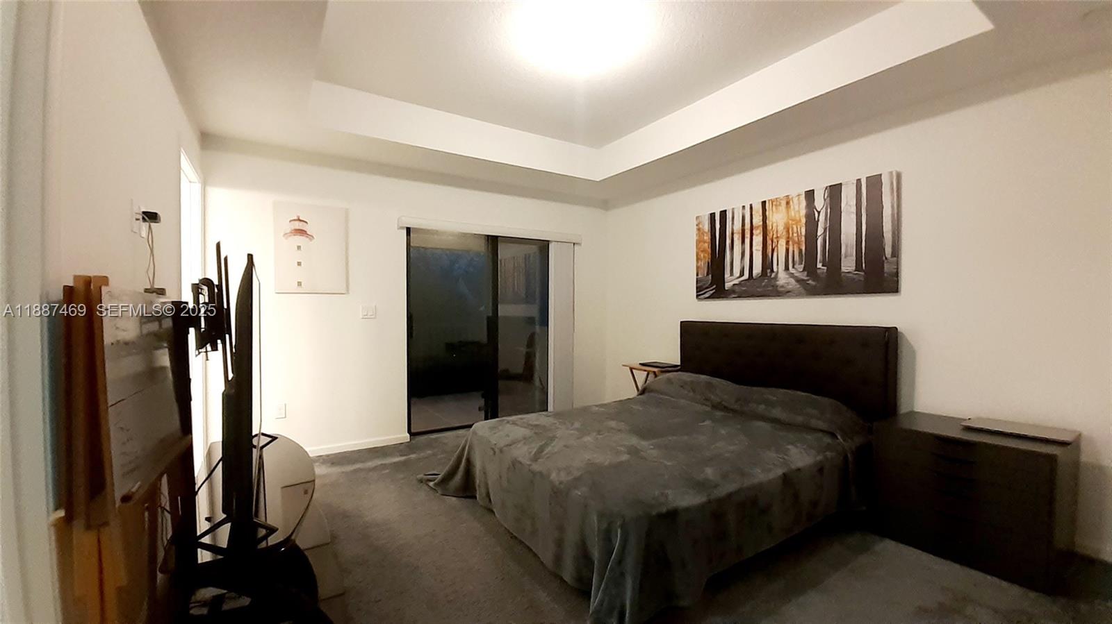 3575 Northwest 1st Street Pompano Beach, FL 33069 - Photo 6 of 18 a bedroom with a bed and dresser