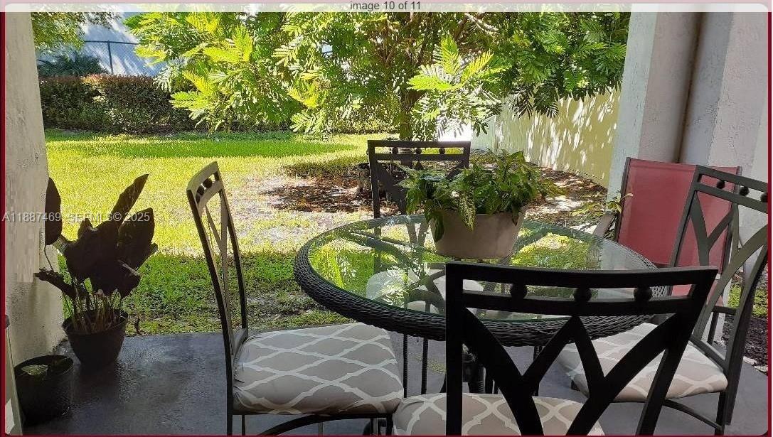 3575 Northwest 1st Street Pompano Beach, FL 33069 - Photo 10 of 18 a view of a chairs and table in the patio