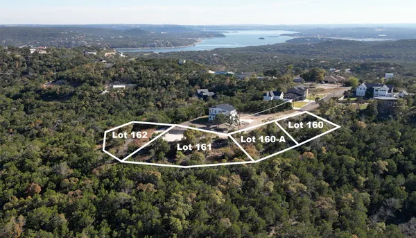 an aerial view of house with yard