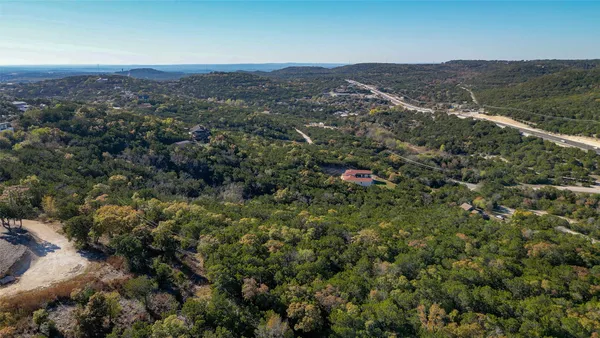 an aerial view of residential house and green space