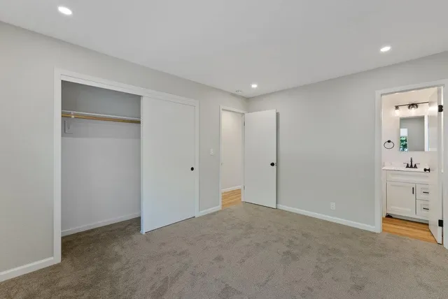 a bathroom with a toilet sink and shower