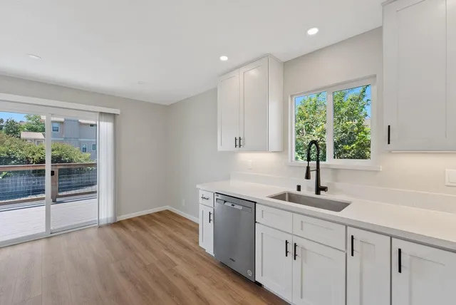 a kitchen with sink and window