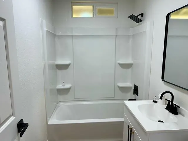 a bathroom with a sink and a bathtub