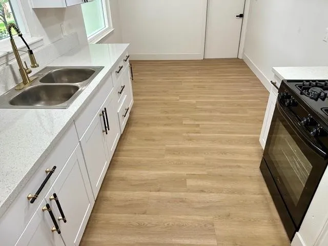 a bathroom with a sink and a washing machine