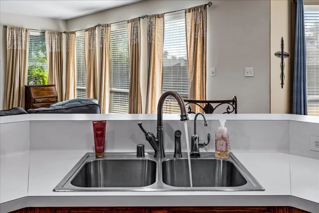 a kitchen with a sink and a window