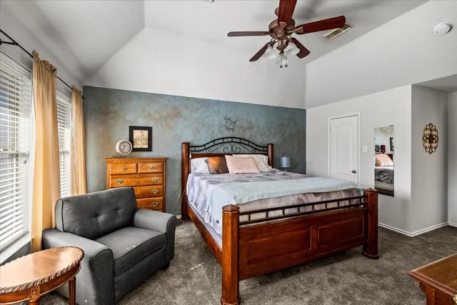 a bathroom with a granite countertop tub sink and mirror