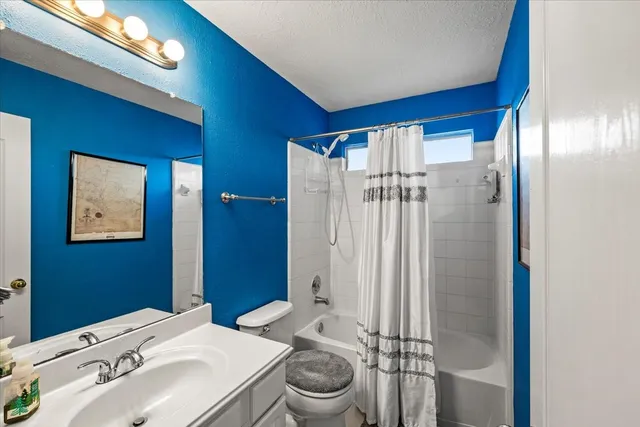 wooden floor and chandelier fan in a room