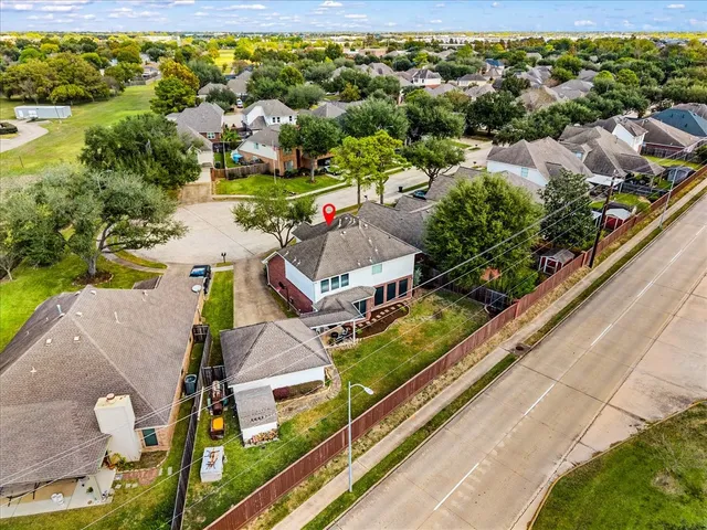 an aerial view of a house with a garden