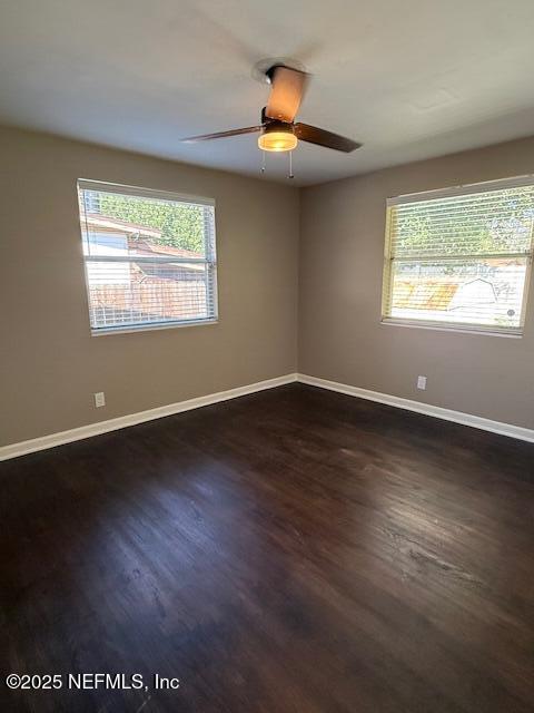 2819 Robinette Drive Orange Park, FL 32073 - Photo 11 of 15 an empty room with wooden floor and windows