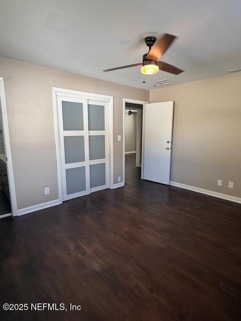 2819 Robinette Drive Orange Park, FL 32073 - Photo 12 of 15 an empty room with wooden floor chandelier fan and windows
