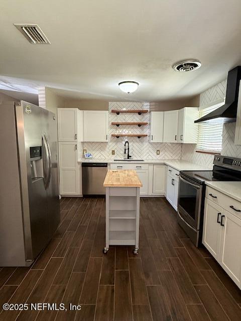 2819 Robinette Drive Orange Park, FL 32073 - Photo 7 of 15 a kitchen with stainless steel appliances a stove a sink and a refrigerator