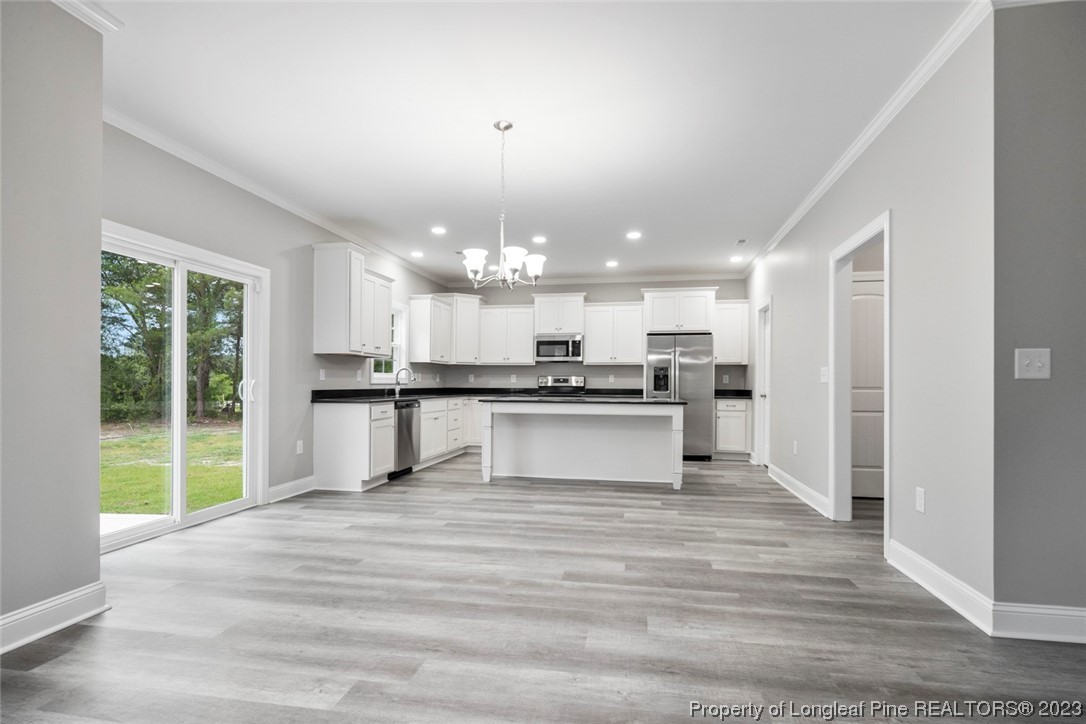 4750 Blue Sand Hill Road Fayetteville, NC 28312 - Photo 15 of 42 a view of kitchen with wooden floor