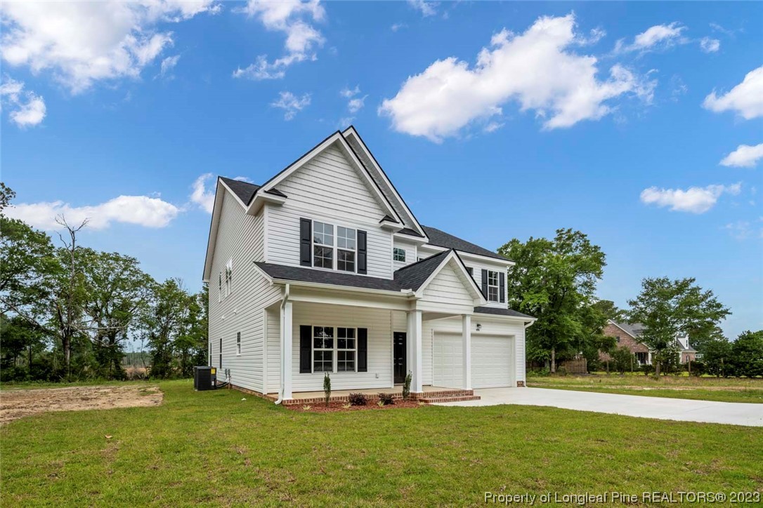 4750 Blue Sand Hill Road Fayetteville, NC 28312 - Photo 2 of 42 a front view of a house with a yard