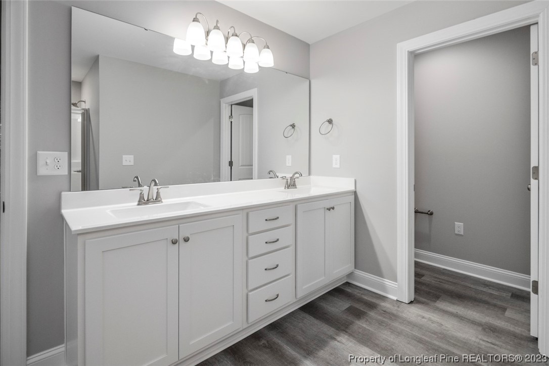 4750 Blue Sand Hill Road Fayetteville, NC 28312 - Photo 30 of 42 a spacious bathroom with double sink a mirror and a shower