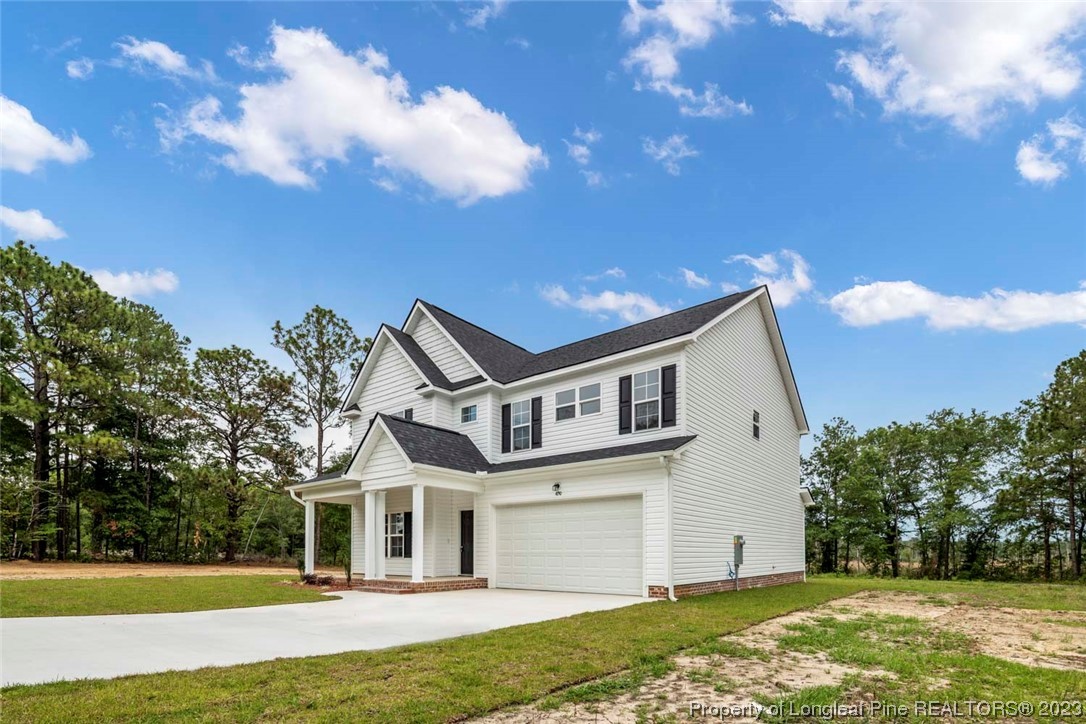 4750 Blue Sand Hill Road Fayetteville, NC 28312 - Photo 3 of 42 a front view of a house with a yard
