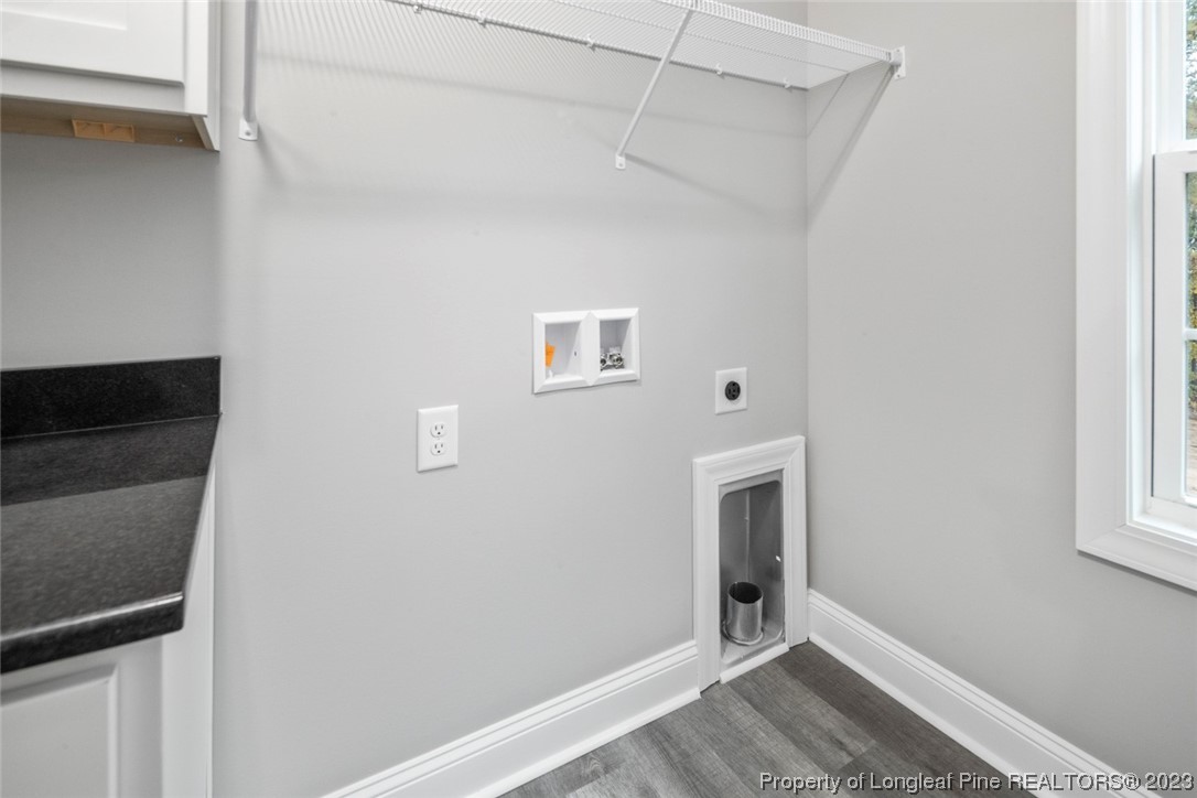 4750 Blue Sand Hill Road Fayetteville, NC 28312 - Photo 32 of 42 a view of an empty room with wooden floor and a window