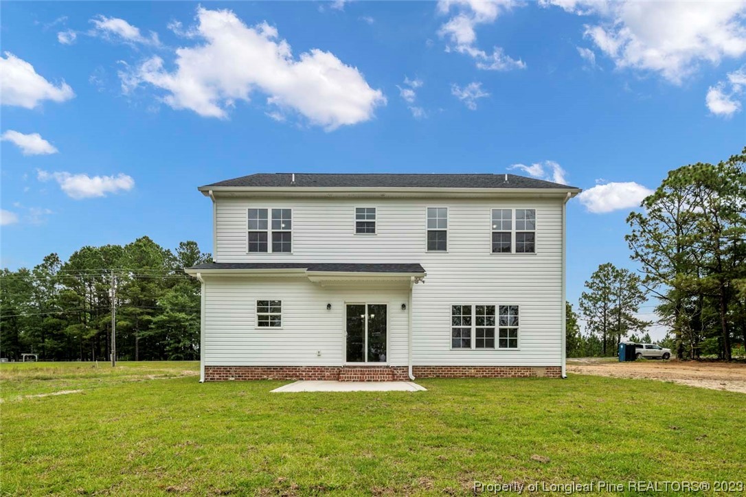 4750 Blue Sand Hill Road Fayetteville, NC 28312 - Photo 42 of 42 a front view of a house with a garden