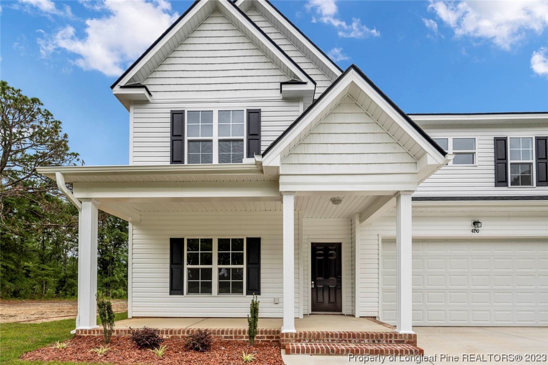 4750 Blue Sand Hill Road Fayetteville, NC 28312 - Photo 6 of 42 a view of a white house with large windows