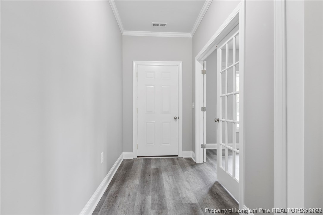 4750 Blue Sand Hill Road Fayetteville, NC 28312 - Photo 8 of 42 a view of a hallway with wooden floor