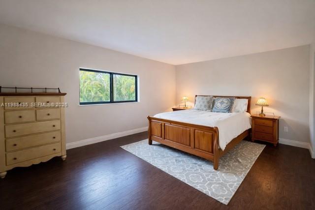 18163 Southwest 149th Place Miami, FL 33187 - Photo 13 of 49 a bedroom with a bed and window