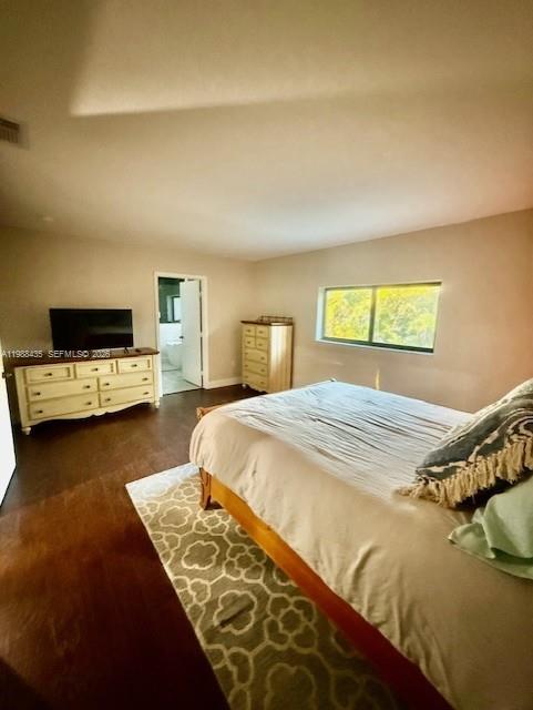 18163 Southwest 149th Place Miami, FL 33187 - Photo 14 of 49 a bed sitting in a bedroom and view of living room