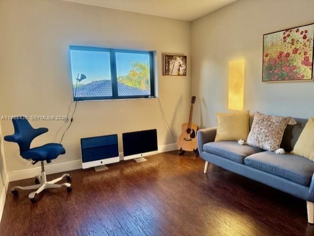 18163 Southwest 149th Place Miami, FL 33187 - Photo 15 of 49 a living room with furniture and a fireplace