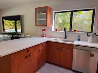 18163 Southwest 149th Place Miami, FL 33187 - Photo 16 of 49 a kitchen with a sink and large window