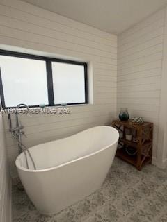 18163 Southwest 149th Place Miami, FL 33187 - Photo 20 of 49 a white bath tub sitting in a bathroom