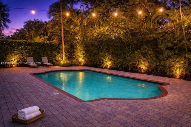 18163 Southwest 149th Place Miami, FL 33187 - Photo 2 of 49 a view of a backyard with swimming pool