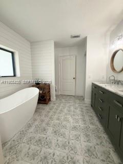 18163 Southwest 149th Place Miami, FL 33187 - Photo 21 of 49 a spacious bathroom with a tub sink and mirror