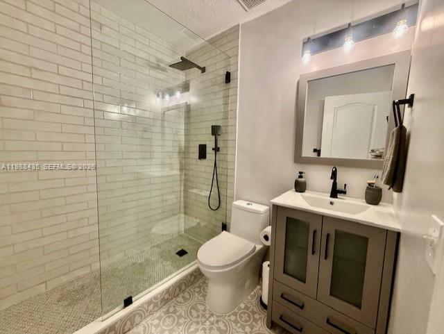 18163 Southwest 149th Place Miami, FL 33187 - Photo 25 of 49 a bathroom with a granite countertop sink a toilet and shower