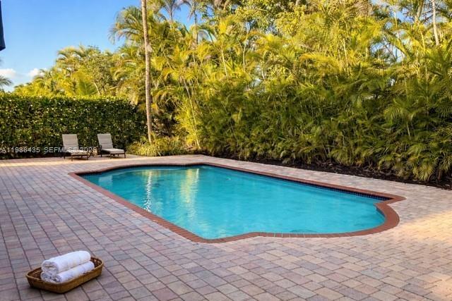 18163 Southwest 149th Place Miami, FL 33187 - Photo 45 of 49 a view of a backyard with swimming pool