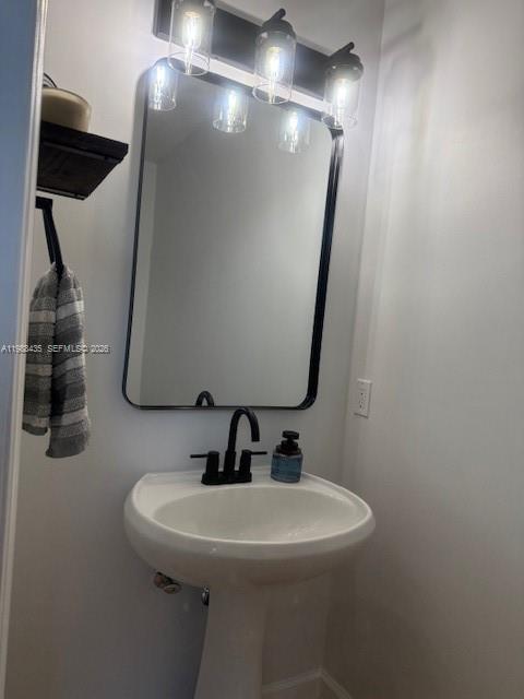 18163 Southwest 149th Place Miami, FL 33187 - Photo 47 of 49 a bathroom with a sink and mirror