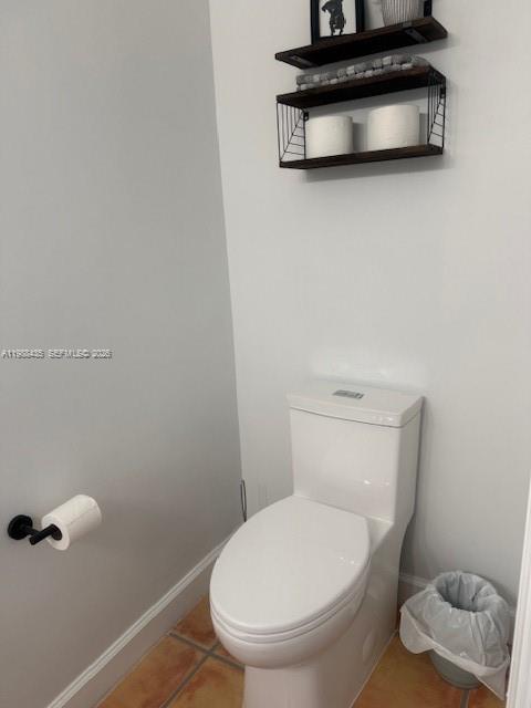 18163 Southwest 149th Place Miami, FL 33187 - Photo 48 of 49 a white toilet sitting next to a bathroom sink